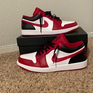 Jordan low 1s size 12 colors are red black and white